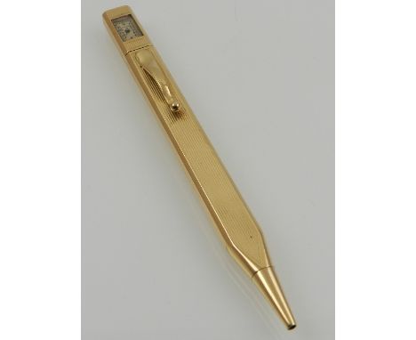 Alfred Dunhill, England. An Art Deco 14ct gold retractable pencil, with built-in Dunhill watch to top. L: 13cm 