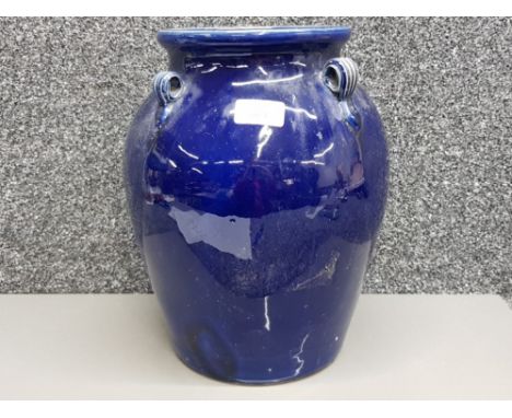 A blue glazed ceramic vase by Dong Thann Donegal pottery