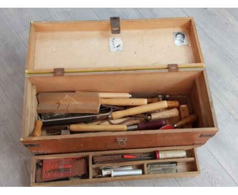 Vintage tool box full of vintage wooden hand tools
