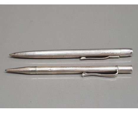 A silver cased pen and propelling pencil inscribed Eileen Warwick
