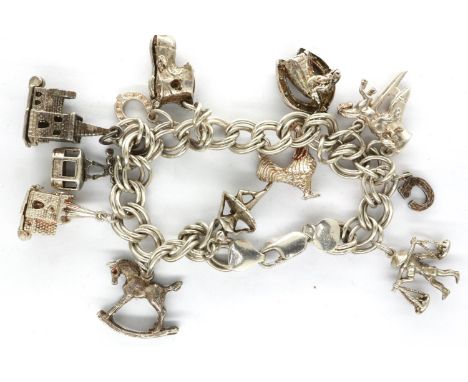 925 silver charm bracelet with thirteen charms, L: 18 cm. P&amp;P Group 1 (£14+VAT for the first lot and £1+VAT for subsequen