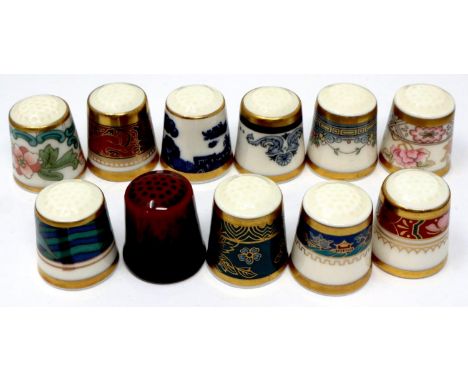 Eleven Royal Doulton ceramic thimbles. P&amp;P Group 1 (£14+VAT for the first lot and £1+VAT for subsequent lots) 