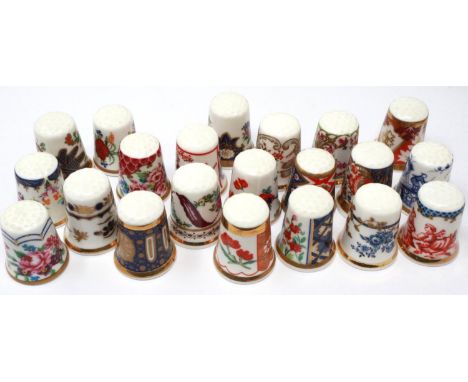 Twenty one Royal Worcester ceramic thimbles. P&amp;P Group 1 (£14+VAT for the first lot and £1+VAT for subsequent lots) 