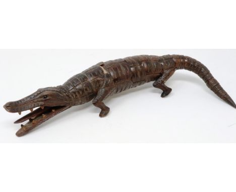 19th century carved wood articulated crocodile, L: 31 cm, one visible repair and loss to body. P&amp;P Group 1 (£14+VAT for t