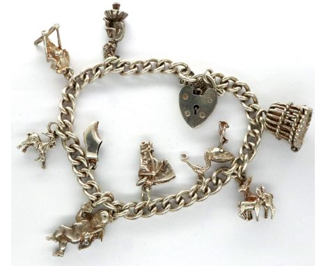 Hallmarked silver charm bracelet with nine 925 silver charms, and hallmarked silver clasp, L: 18 cm, combined 36g. P&amp;P Gr