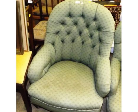 A Victorian mahogany and button back armchair