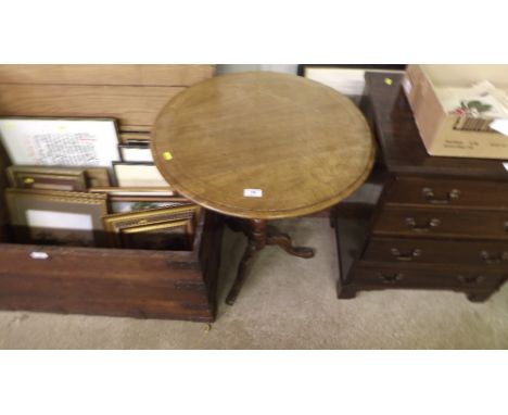 A mahogany circular top tripod table