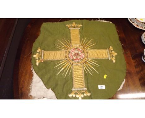 A needlework tapestry depicting a rose