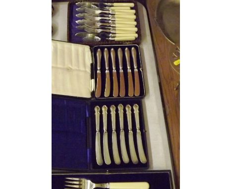 A cased fish knife and fork; two sets of silver handled butter knives and a cased set of fish knives and forks