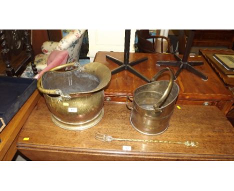 Two copper coal scuttles and a toasting fork 