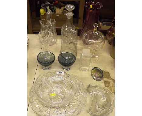 A quantity of glassware to include an amethyst glass vase; fruit bowls; decanters and stoppers etc.