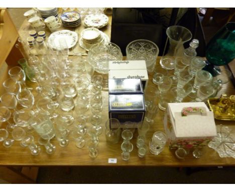 A quantity of various drinking glasses; bowls; vases and a brass chamber stick