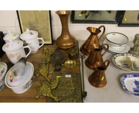 A set of three copper graduating jugs; various brassware to include an embossed plaque; two pistols; a toasting fork; a pair 
