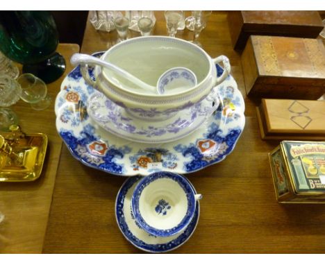 A large blue and white meat plate; a floral decorated tureen on stand with ladle and a large blue and white 'Old Willow' patt