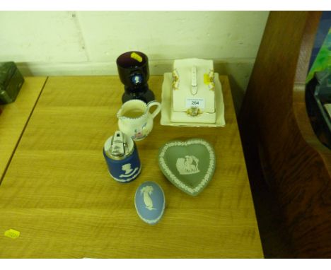 Three items of Wedgwood japserware; a Wedgwood glass goblet; a small Poole pottery jug; and a commemorative butter dish 