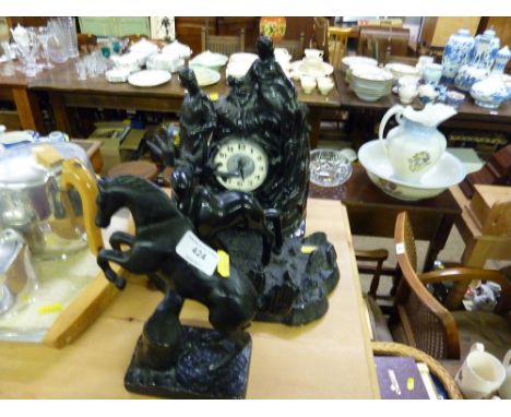 Two cast metal animal figure groups and a mantel clock