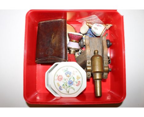 A box containing a small model canon; a leather cigar case; a Pandora style bracelet; compact etc.