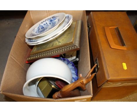 A case of LPs together with a box containing a wall clock; a chamber pot; blue and white plates and various sundries