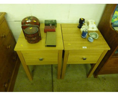 A pair of light oak bedside tables each fitted with single drawers