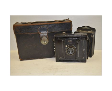 Goerz Anschutz Strut Folding Camera,   120mm f/6 Dagor lens, quarter plate with a roll film back and film pack holders, in ma