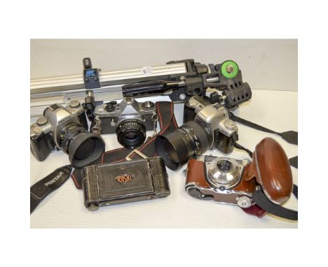 A Box of Cameras and Accessories, including three Pentax SLRs, a Kodak Retinette 1B, a Slik Tripod and more