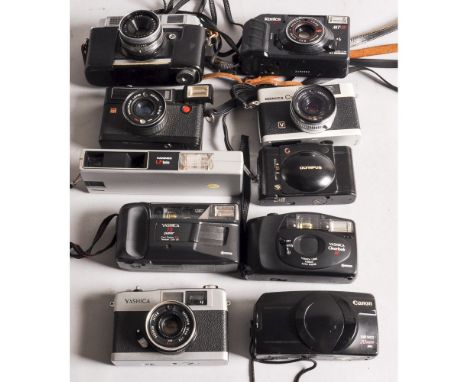 Rangefinder Cameras,  a Mamiya Rank, Yashica 35-ME, Konica C35 and a Halina Autoflash 35 together with a quantity of compact 