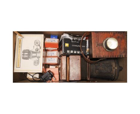 Zenith Model E SLR Camera, in manufacturer's box together with a small wooden enlarger, Agfa slide mounts (a lot), Nikon Cool
