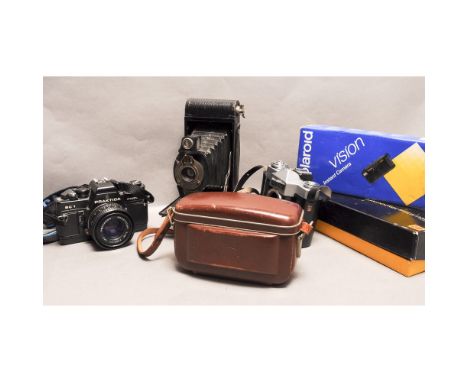 A Tray of Cameras, including a Praktica SC 1 electronic SLR with 50mm f/1.8 lens, a Kodak pocket Instamatic 60, a Zeiss Ikon 