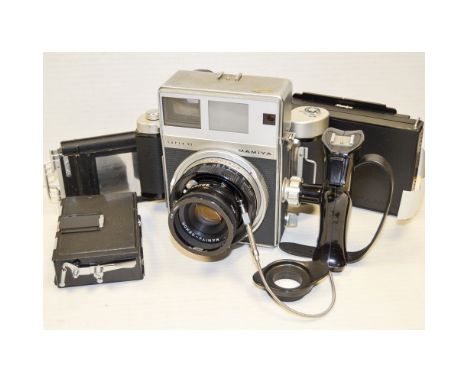 A Mamiya Super 23, with a Sekor 100mm f/3.5, 6 x 7 roll film back, 6x9 ground glass back, Polaroid back and additional DDS in
