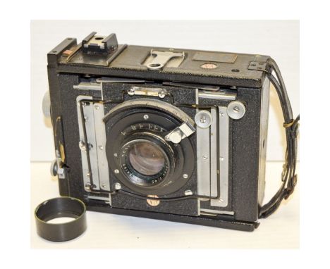 Van Neck Press Master, 5x4 strut folding camera with a Ross Xpres 6" f/4.5 lens and focal plane shutter body F, optics F