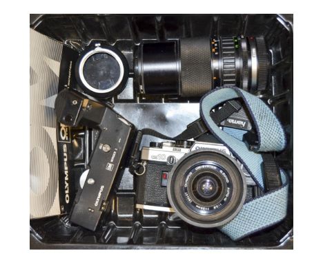 Olympus OM10 SLR Camera, with Zuiko 35mm f/2.8, 75-150mm f/4 autozoom, winder and instruction manual 