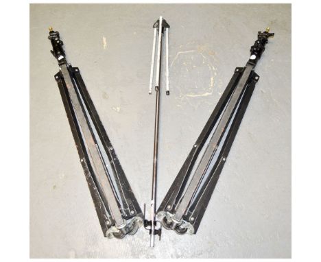 A Pair of Lighting Stands, with castor feet together with one other 