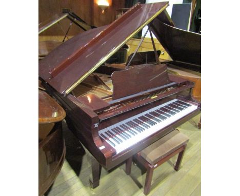 Yamaha (c1997)A 5ft 8in Model C2 grand piano in a bright mahogany case on square tapered legs; together with a stool.
