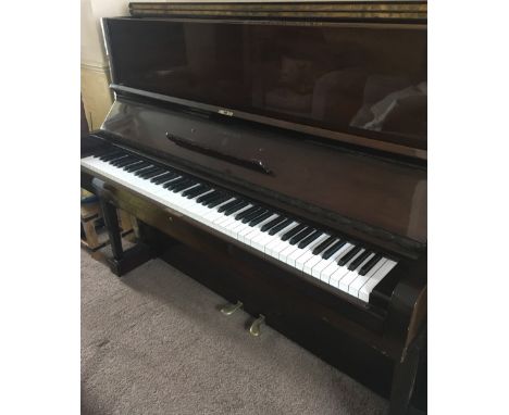 Steinway (c1938)A Model V upright piano in a mahogany case.