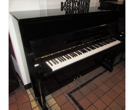 Yamaha (c2012) A Model B1 upright piano in a bright ebonised case. AMENDMENT Is (c2004) and is a Model P116.