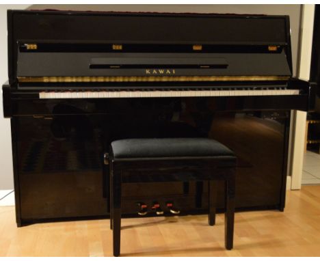 Kawai (c2008) A Model K15E-ATX upright piano in a bright ebonised case, fitted with a silent system; together with a stool.
