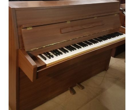 Yamaha (c1984)A Model LU-101 upright piano in a modern simulated walnut veneered case.