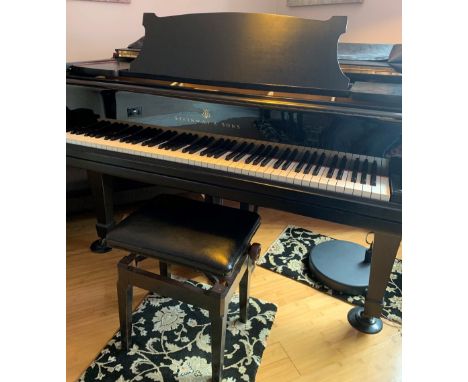 Steinway  (c1930)A 5ft 10in 88-note Model O grand piano in a satin ebonised case on square tapered legs; together with a cove