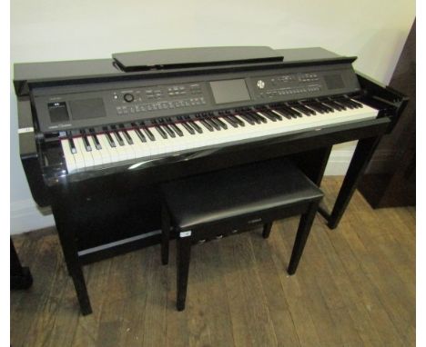 YamahaA Model CLP675/85 clavinova in a bright ebonised case. AMENDMENT Is a Model CVP605 together with a stool.