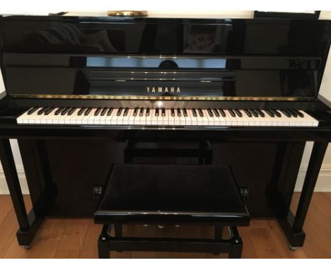 Yamaha (c2010) A Model B2 upright piano in a bright ebonised case; together with a matching stool. 