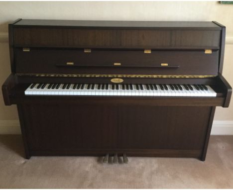 Kemble (c1994)A Cambridge Model upright piano in a satin walnut case; together with a stool.