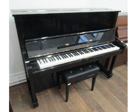 Yamaha (c1974)A Model U1 upright piano in a bright ebonised case; together with a matching stool. 