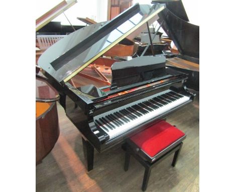 Yamaha (c2012) A 5ft 3in Model GC1 grand piano in a bright ebonised case; together with a stool.