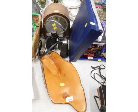 A wooden plaque, mantel clock, 12x50 binoculars, and a empty blue presentation box. (4) 