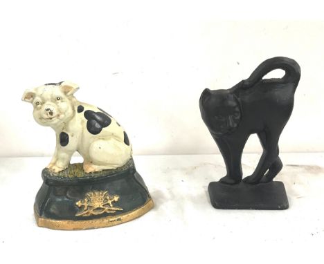 2 Vintage cast iron door stops, includes a pig and a cat 