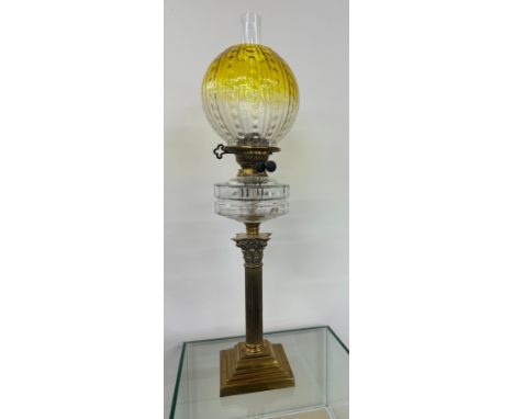 Antique brass collum base glass oil lamp complete with shade and funnel. 