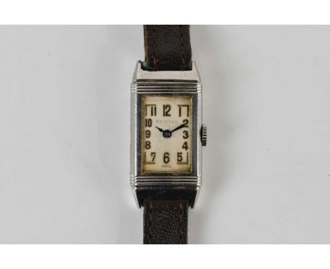 NEW EPOCH WATCH CO; a vintage lady's Reverso wristwatch, with Arabic numerals to the rectangular dial and with 15 jewel movem