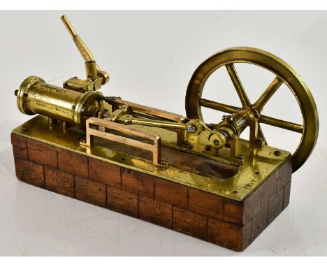 A scratch built live steam engine, single piston, on wooden plinth base, length 23cm.