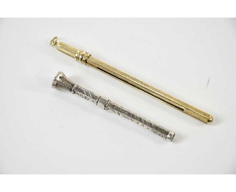 A gold plated hallmarked silver cocktail swizzle stick, with a white metal toothpick (2)