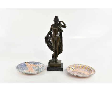 A modern bronze figure of a female nude, on square marble base, height 42cm, with two faience plates decorated with female nu